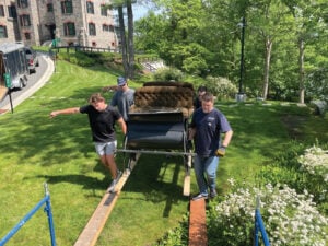 Longyear Museum staff move a sleigh from Mary Baker Eddy's final home at 400 Beacon Street.